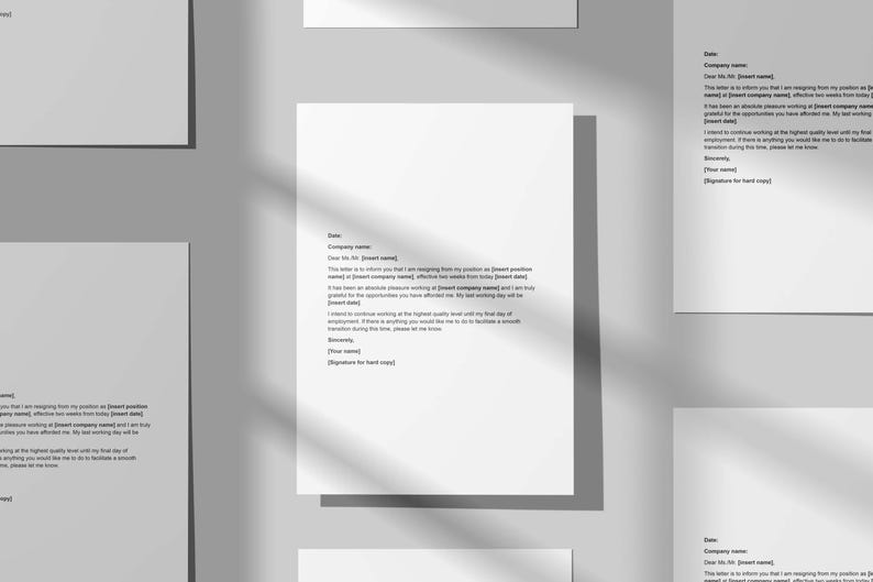 May include: Several white sheets of paper with text are arranged on a gray surface. The papers appear to be resignation letters, with text including "Dear Mr/Ms" and "Company Name". The image has soft shadows.