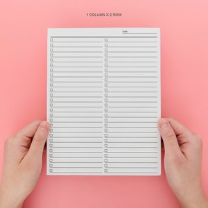 May include: A white checklist with two columns and 25 rows. Each row has a checkbox and a blank line for writing. The checklist has the text "1 COLUMN X 2 ROW" at the top and the word "Date" at the top of the right column.