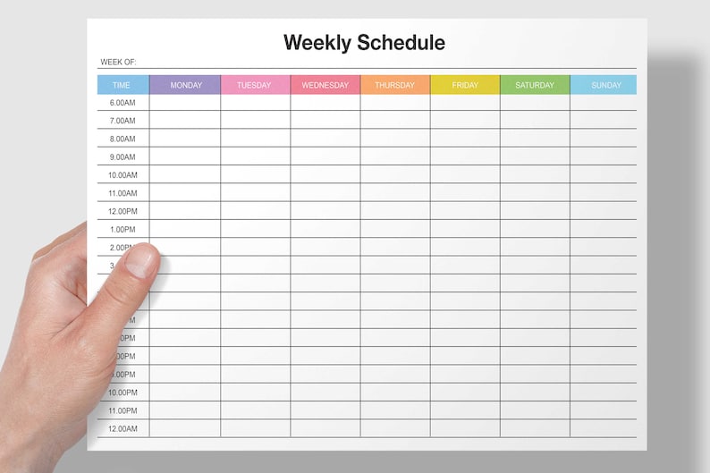 May include: A weekly schedule planner with a blank grid for each day of the week. The days are labeled with colored headers: Monday (purple), Tuesday (pink), Wednesday (orange), Thursday (yellow), Friday (green), Saturday (light blue), and Sunday (blue).