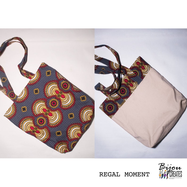 Pode incluir: Uma bolsa tote com fundo cinza e um padr&atilde;o colorido de c&iacute;rculos vermelhos, amarelos e brancos. A bolsa tem um forro de lona bege e uma al&ccedil;a de tecido combinando.