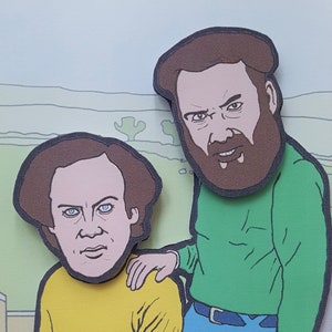 May include: Two cartoon illustrations of men with brown hair and beards. The man on the left is wearing a yellow shirt. The man on the right is wearing a green shirt and blue jeans.