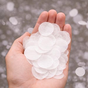 May include: A collection of white, circular confetti pieces measuring 4cm in diameter. The text "Large 4cm Circles" and "Soft, lightweight confetti for the perfect slow flutter" is printed at the top of the image in a clear, sans-serif font.