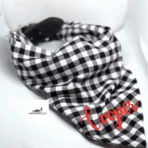 May include: Black and white checkered dog bandana with the name "Cooper" embroidered in red.
