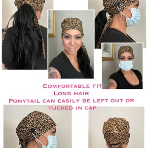 May include: Leopard print surgical scrub hat with a ponytail opening and button/mask ear savers.  The hat is tied at the back with long ties.  "COMFORTABLE FIT LONG HAIR PONYTAIL CAN EASILY BE LEFT OUT OR TUCKED IN CAP BUTTON/MASK EAR SAVERS OPTIONAL" is printed on the image.