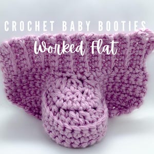 May include: A close-up of a crocheted baby bootie in a soft lavender color. The text "CROCHET BABY BOOTIES" and "Worked Flat" are displayed in white. The bootie is handmade with a ribbed texture.