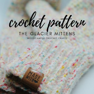 May include: Close-up of a colorful crochet mitten with a "Made With" label. The text "crochet pattern THE GLACIER MITTENS WOODCAMPER CROCHET CRAFTS" is visible above the mitten.