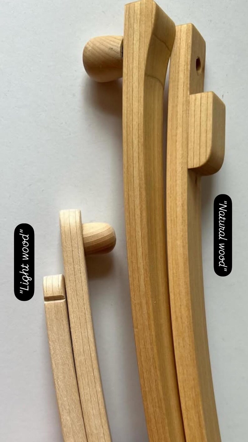May include: Two wooden embroidery hoops, one with a natural wood finish and the other with a lighter wood finish. The hoops are labeled "Natural wood" and "Light wood".