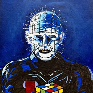 May include: A painting of a character with a grid-like pattern on the head, adorned with pins, and a grimacing expression. The character is holding a colorful Rubik's Cube against a dark blue background.