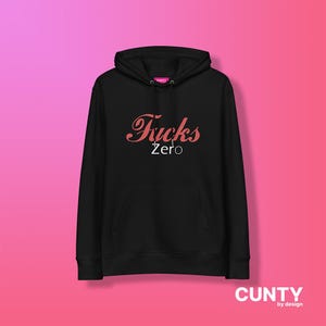 May include: Black hooded sweatshirt with the text "F*cks Zero" in pink lettering.