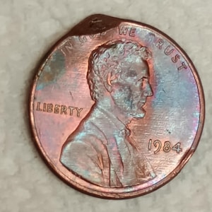 1984 Lincoln memorial penny Indent error several strike through on the rim above State and below Lincoln on rim errors off center DDOtr dchi