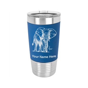 May include: A stainless steel travel tumbler with a blue band featuring a white etched elephant design. The tumbler has a silver lid and base, with the text "Your Name Here" below the elephant illustration.