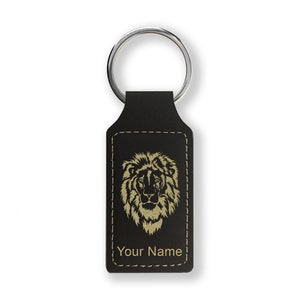 May include: Black leather keychain with a gold lion head design and the text "Your Name".