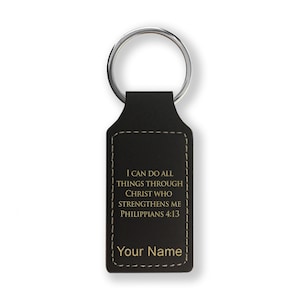 May include: Black leather keychain with a gold inscription that reads "I can do all things through Christ who strengthens me Philippians 4:13" and "Your Name".