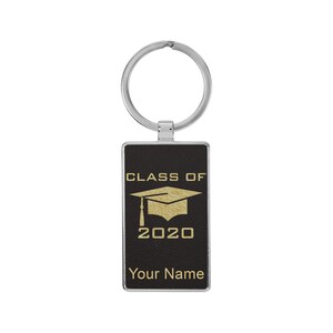 May include: Black leather keychain with a silver key ring. The keychain has a gold graduation cap and the text "Class of 2020" and "Your Name".
