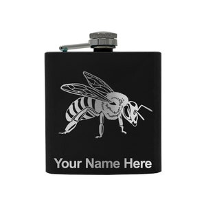 May include: Black stainless steel flask with a silver bee design and the text "Your Name Here" engraved on the front.