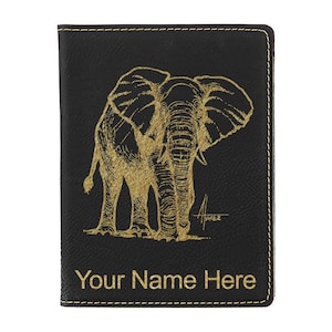 May include: Black leather passport holder with a gold embossed image of an elephant. The text "Your Name Here" is printed in gold at the bottom.