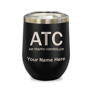 May include: Black stainless steel wine tumbler with a silver lid. The tumbler has the text "ATC AIR TRAFFIC CONTROLLER" and "Your Name Here" printed on it.