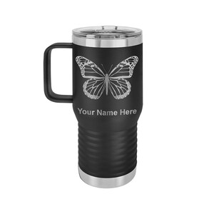 May include: Black stainless steel travel mug with a butterfly design and the text "Your Name Here" engraved on the side.