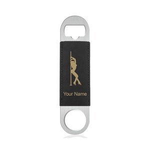 May include: A black leather bottle opener with a silver metal top and a gold silhouette of a woman on a pole. The text "Your Name" is printed below the silhouette.