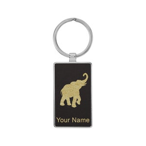 May include: Black leather keychain with a gold elephant silhouette and the text "Your Name".