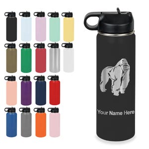 May include: A black cylindrical water bottle with a black lid and a handle, featuring a silver-toned engraved gorilla graphic and the text Your Name Here. The image also displays a grid of nineteen additional water bottles in various solid colors.
