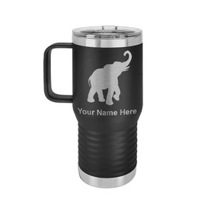May include: Black travel mug with a silver elephant design and the text "Your Name Here". The mug has a black handle, a silver rim, and a clear lid. The mug is approximately 7 inches tall.