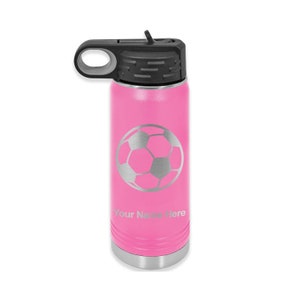 May include: Pink stainless steel water bottle with a silver soccer ball design and the text "Your Name Here".