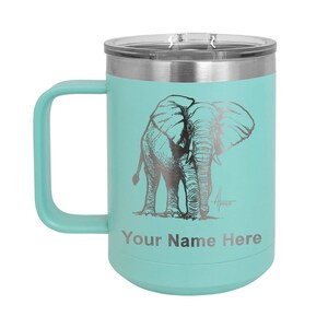 May include: A teal stainless steel travel mug with a black and white elephant illustration and the text "Your Name Here".