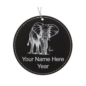 May include: Black leather ornament with a white line drawing of an elephant and the text "Your Name Here Year".