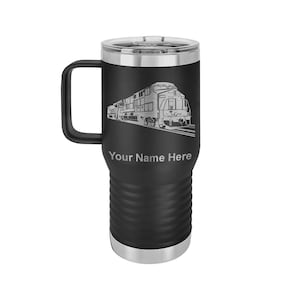 May include: Black stainless steel travel mug with a handle. The mug has a laser engraved design of a train with the text "Your Name Here" below the image.