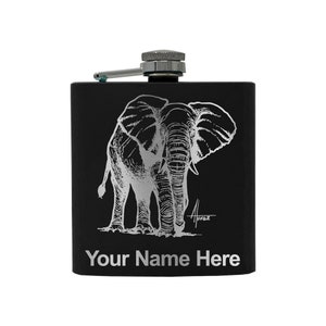 May include: Black flask with a silver engraved image of an elephant. The flask has a silver cap and a personalized inscription that reads "Your Name Here".