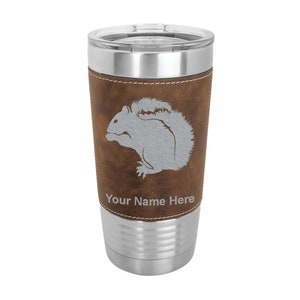 May include: A brown leather-wrapped stainless steel tumbler with a gray squirrel silhouette and the text "Your Name Here".