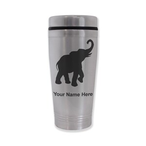 May include: Silver travel mug with a black silhouette of an elephant with its trunk raised. The text "Your Name Here" is printed below the elephant.