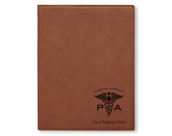 May include: Brown leather journal with a black engraved Physician Assistant logo and the text "PA" and "Your Name Here".