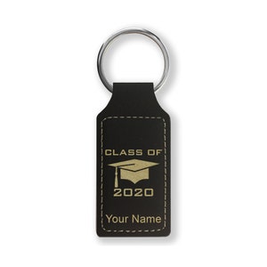 May include: Black leather keychain with a gold inscription that reads "Class of 2020" and a graduation cap icon. The keychain also has a personalized name.
