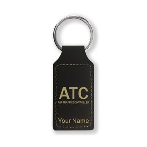 May include: Black leather keychain with a gold inscription that reads "ATC Air Traffic Controller" and "Your Name".