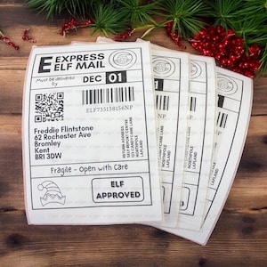 May include: White and black Christmas gift labels featuring an elf design. The labels include the text "Express Elf Mail" and "Elf Approved".