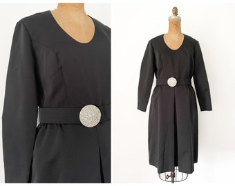 Vintage 1960’s Parues Feinstein black faille cocktail dress / long sleeve, scoop neck, LBD, modest, rhinestone buckle, M