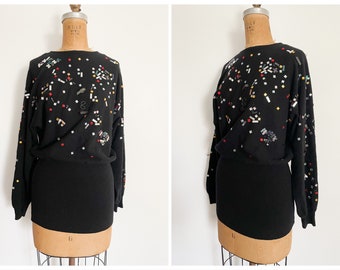 Whimsical ‘80s New Wave sweater or micro mini dress | black lambswool embellished with rhinestones & metal trinkets, S