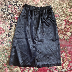Vintage late ‘70s early ‘80s black soft satin skirt, black, below the knee, high waisted, XS