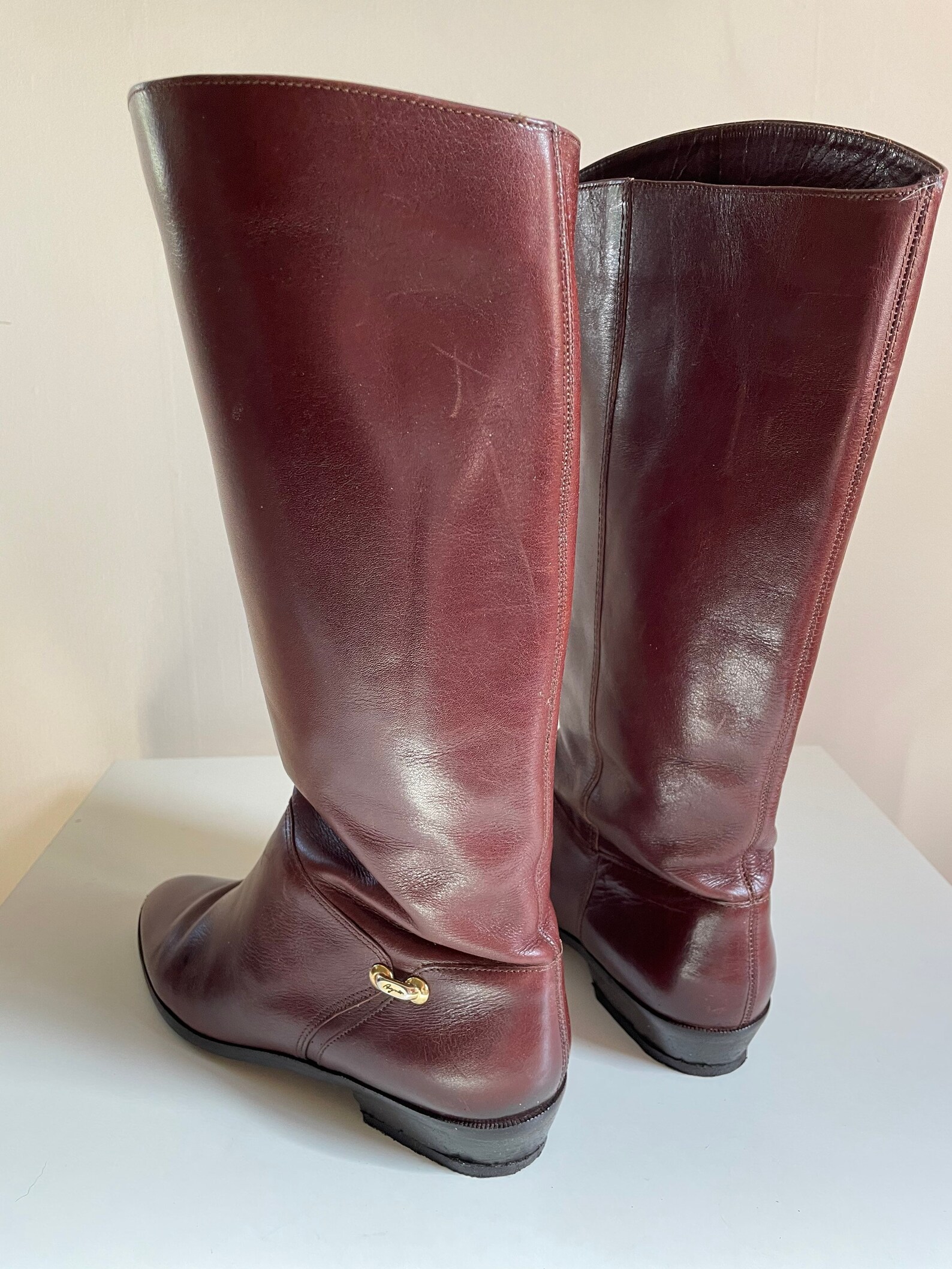 etienne aigner riding boots with stamped logo