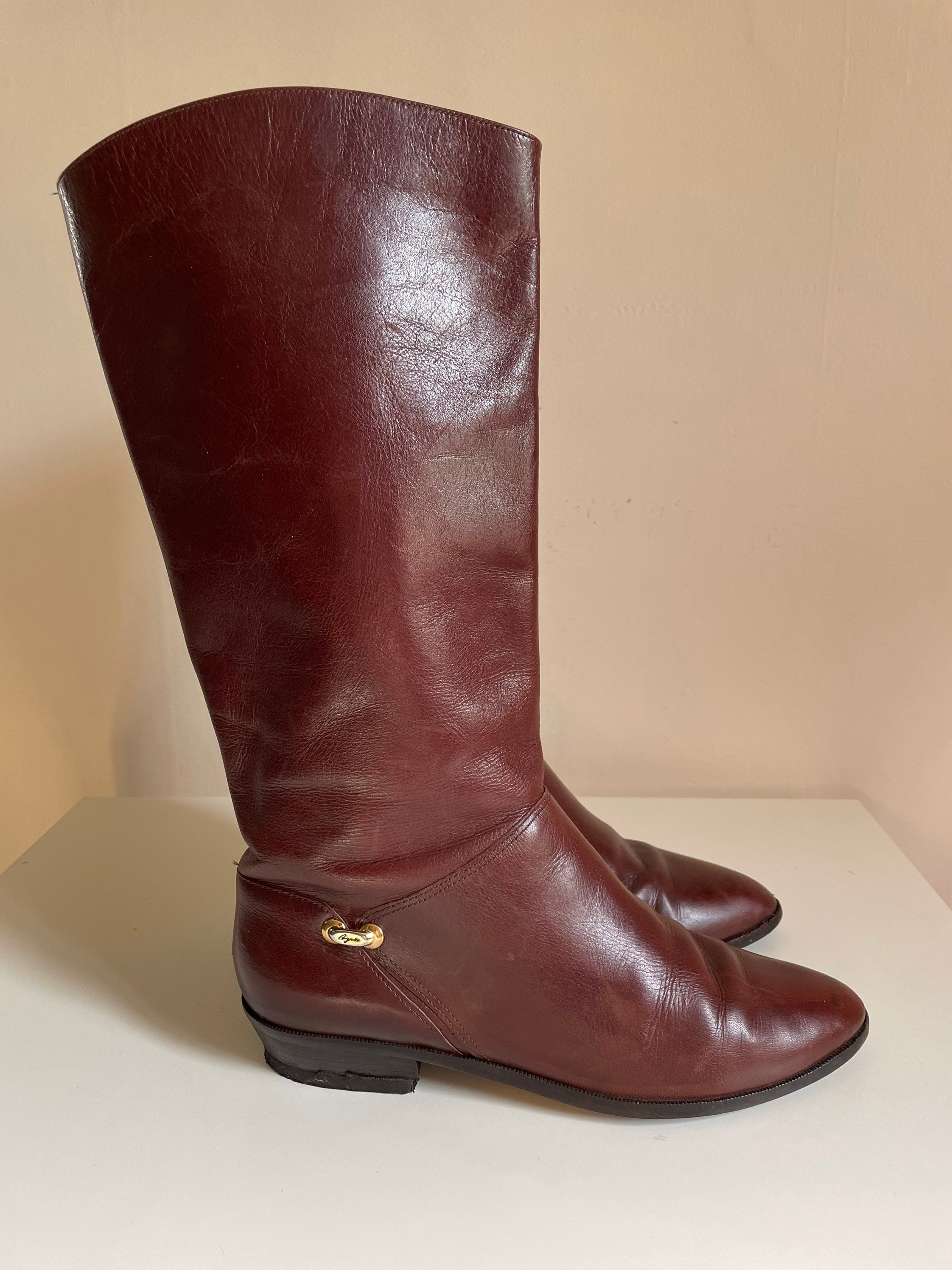 etienne aigner riding boots with stamped logo