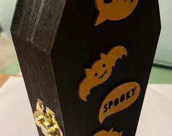 Coffin box with ghost on it