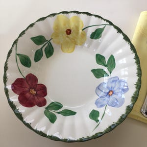 May include: A set of three ceramic mugs with a speckled, matte finish. The mugs are in shades of cream, light gray, and dark gray. Each mug has a simple, minimalist design, perfect for coffee or tea.