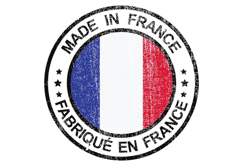 May include: A black and white circular stamp with the text "Made in France" and "Fabriqu&eacute; en France" surrounding a blue, white and red French flag.