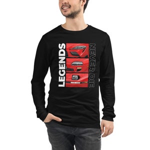 May include: Black long-sleeve shirt featuring a graphic of three red sports car front ends. The text "LEGENDS NEVER DIE" is printed vertically in white. The shirt is made of a soft, comfortable material.