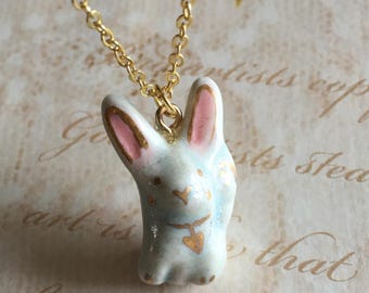 Porcelain tree necklace with gold leaves, gold detail on a clay tree