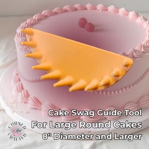 May include: A pink frosted cake with a decorative orange cake swag guide tool. The cake is decorated with pink frosting and two raspberries. Text on the image reads "Cake Swag Guide Tool For Large Round Cakes 8" Diameter and Larger."