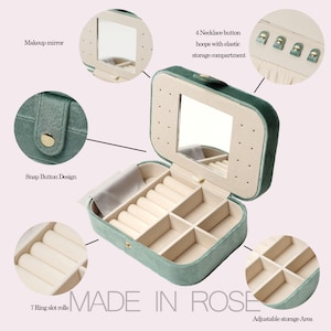 May include: A green velvet jewelry box with a mirror, multiple compartments, and a snap button closure. The box has a ring roll, a necklace storage area, and an adjustable storage area.
