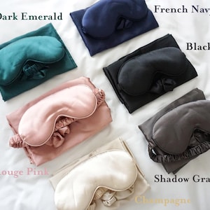May include: Set of 10 silk sleep masks in various colors, including dark emerald, French navy, black, rouge pink, shadow gray, and champagne. Each mask is paired with a matching silk eye mask.